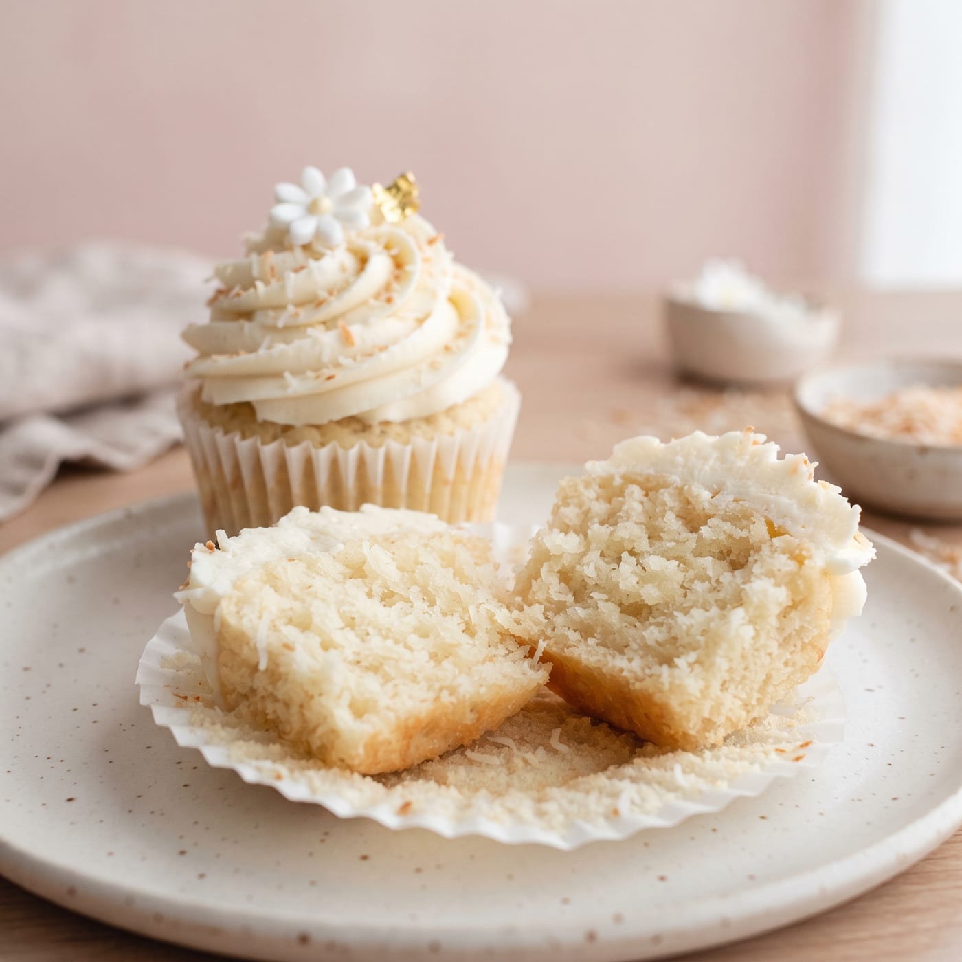 Close up of a coconut milk cupcake crumb showing moist texture