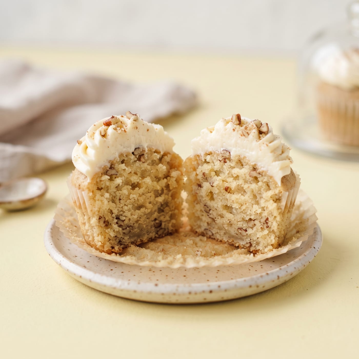 Close up cross section of a keto banana bread cupcake showing moist crumb